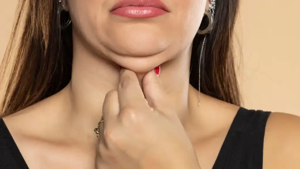 An image of a woman with double chin, sad, worried : Non Surgical Double Chin Removal Treatment in Bedfordshire, UK